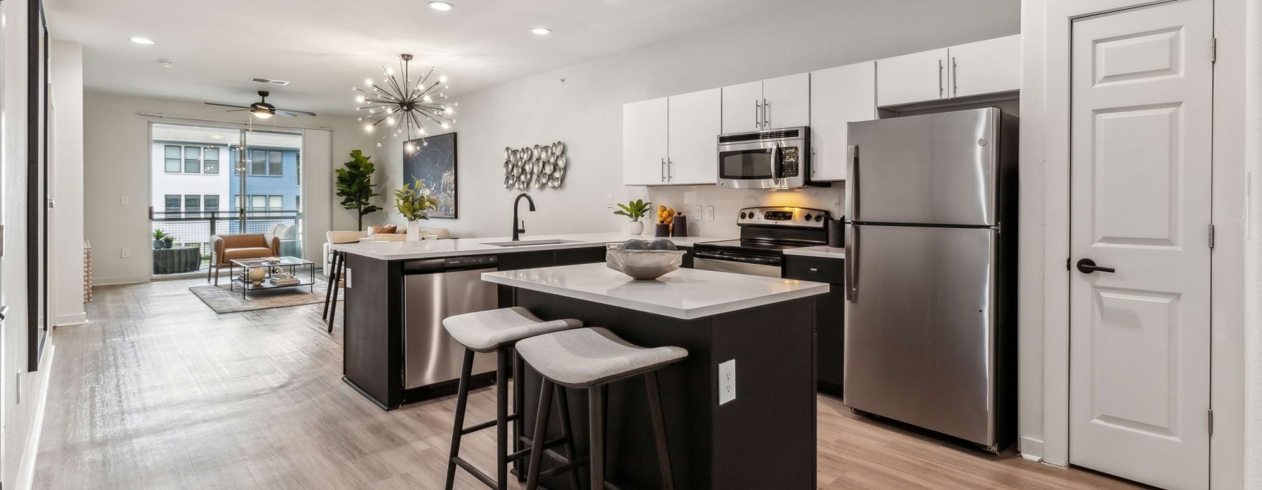 kitchen with white cabinets and pendant lighting